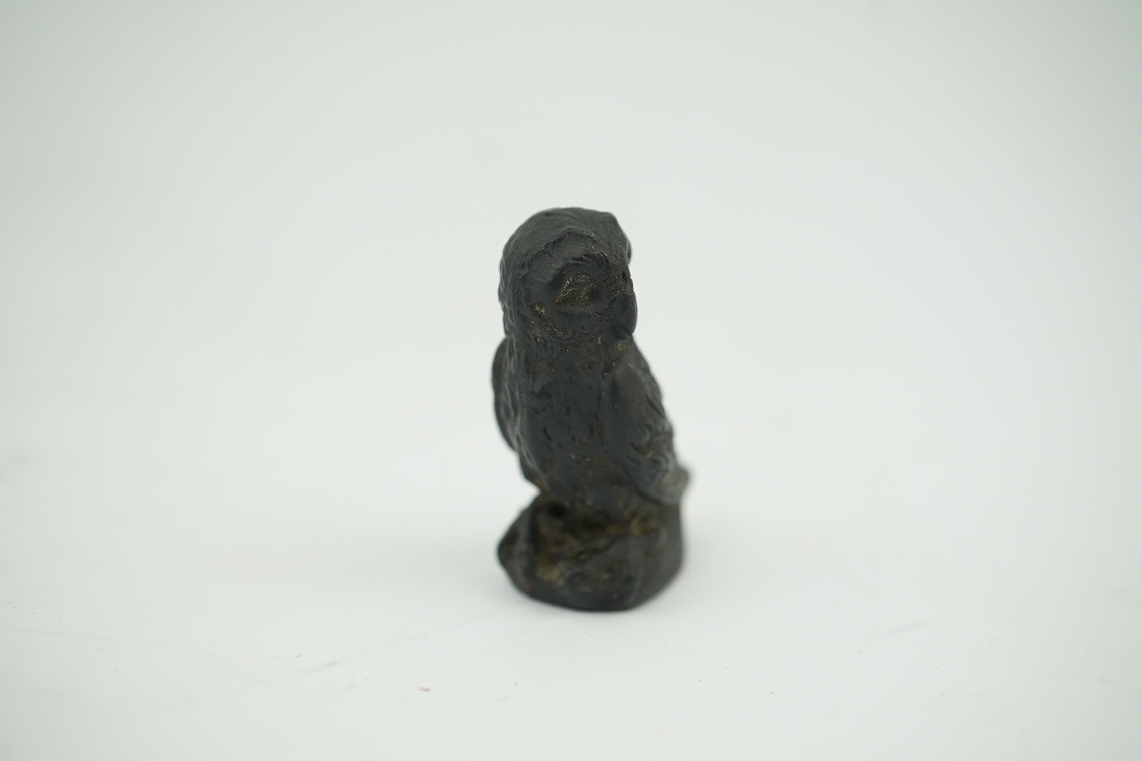 Attributed to Wedgwood, a black basalt intaglio fob seal, c.1809, modelled as an owl, inscribed ‘For further Particulars Enquire Within, 3.5cm high. Condition - good